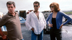 Director John McTiernan, Pierce Brosnan & Rene Russo on the set of The Thomas Crown Affair  (1999)