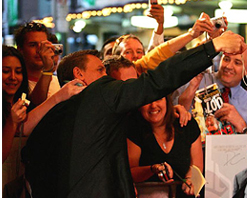 Daniel Craig poses for the waiting fans