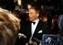 Daniel Craig talks to film crews