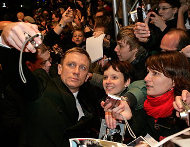 Daniel Craig poses for the waiting fans