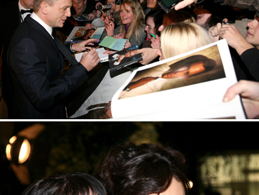 Daniel Craig signs autographs for the waiting fans