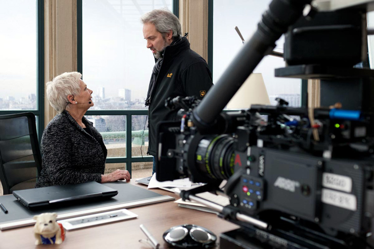 Director Sam Mendes chats with Judi Dench (playing the pivotal role of 'M' for the last time) on the set of Skyfall.