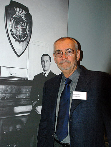 Michael G Wilson and photo of Ian Fleming in 'Room 39'.