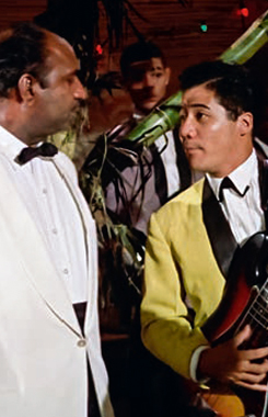 Lester Prendergast as Puss-Feller with Byron Lee