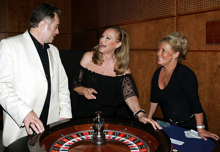 Graham Rye and Ursula Andress at the roulette wheel