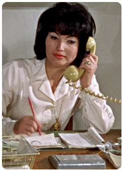 Prof. Dent's Secretary played by Bettina Le Beau
