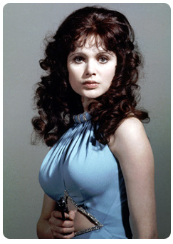 Miss Carusa played by Madeline Smith 