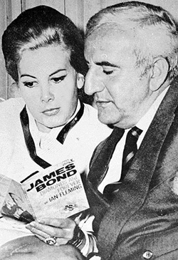Molly Peters & Adolfo Celi reading the PAN Paperback of DIAMONDS ARE FOREVER
