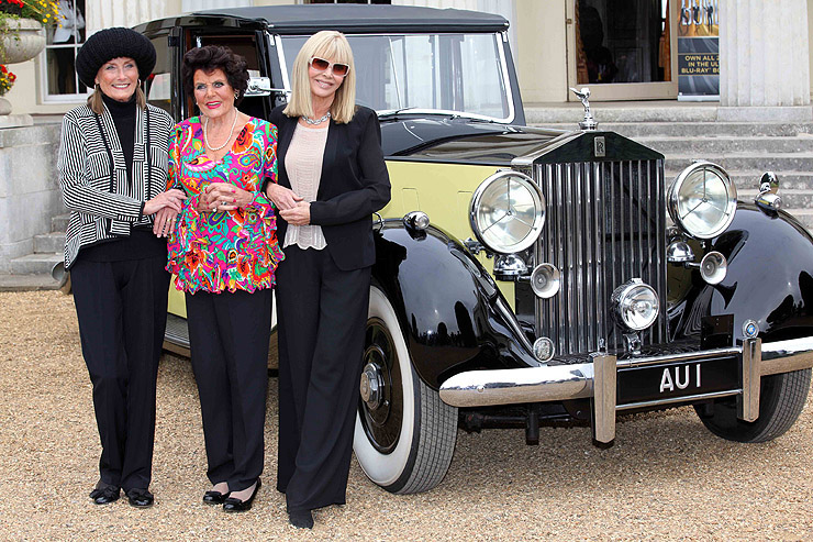 Tania Mallet, Eunice Gayson and Britt Ekland pose in front of Goldfinger's Rolls Royce Phantom III