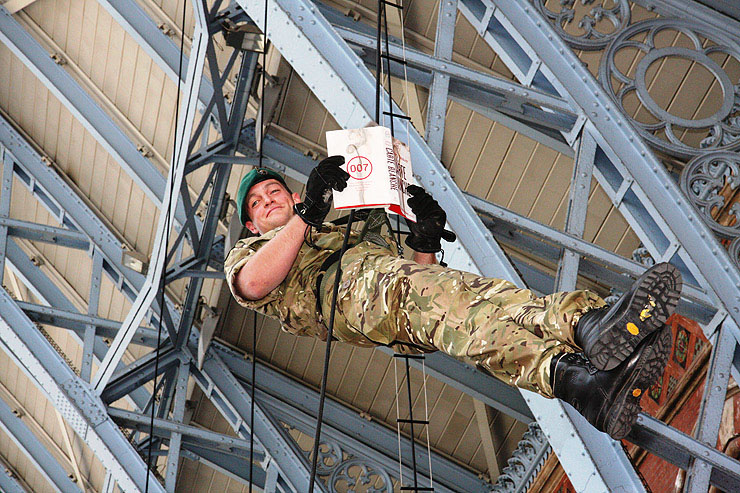 Royal Marines Commandos abseiled from St. Pancras Stations famous listed roof to deliver the first public copies of CARTE BLANCHE