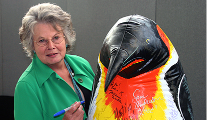 Mollie Peters signs 'Percy the penguin'
