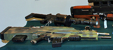 Mark Williams poses with a selection of guns at Christie's October2006