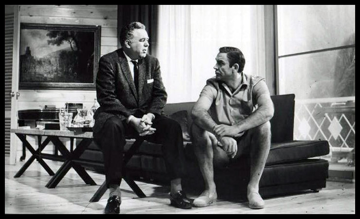 Harry Saltzman chats with Sean Connery on set at Pinewood Studios during the shooting of Thunderball (1965).